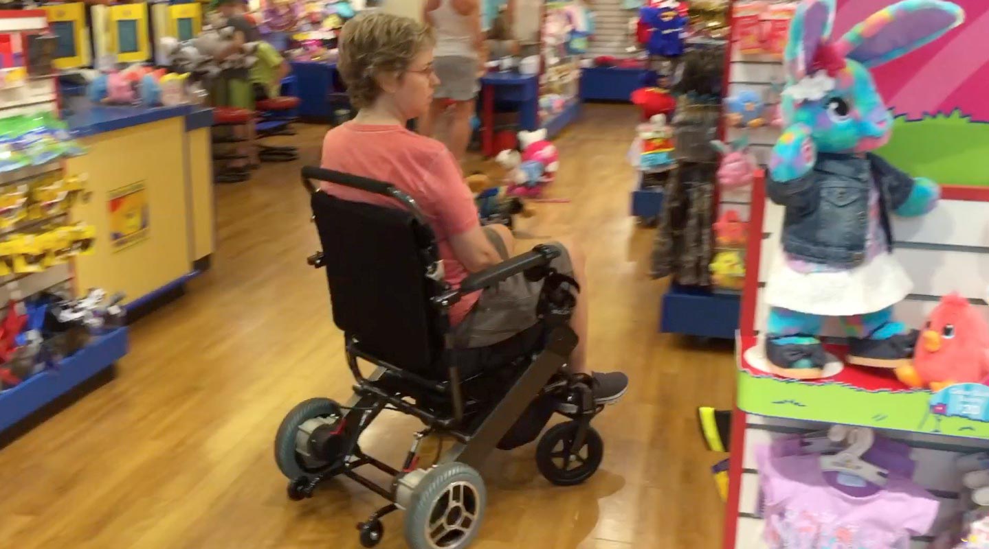 Turning electric wheelchairs